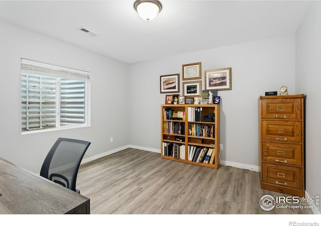 1689 Maseca Plaza Way, Severance, CO 80550 - office space with visible vents, baseboards, and wood finished floors