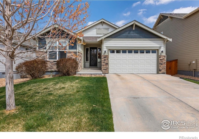 850 Prairiestar Dr, Berthoud, CO 80513 - craftsman house featuring concrete driveway, an attached garage, a front yard, and stone siding