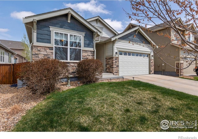850 Prairiestar Dr, Berthoud, CO 80513 - craftsman-style home featuring concrete driveway, a front yard, an attached garage, and stone siding
