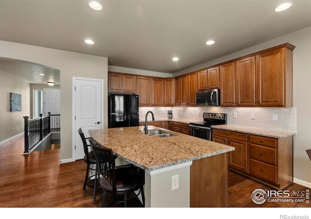 850 Prairiestar Dr, Berthoud, CO 80513 - kitchen with a sink, stainless steel appliances, and brown cabinets