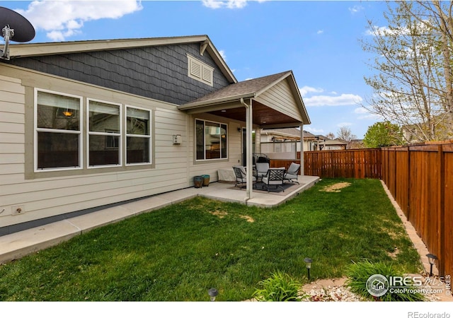 850 Prairiestar Dr, Berthoud, CO 80513 - back of house with a lawn, a patio, and a fenced backyard