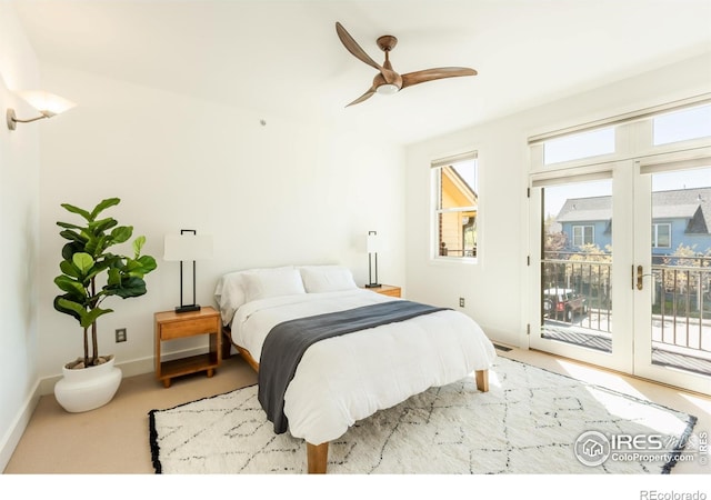bedroom with a ceiling fan, baseboards, and access to exterior