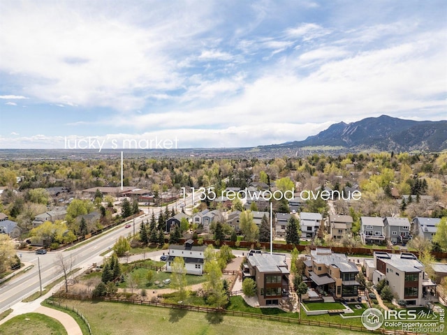 aerial view featuring a mountain view and a residential view