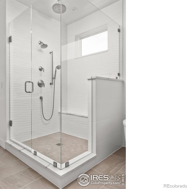 full bath with a shower stall