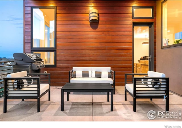 view of patio / terrace featuring an outdoor living space and grilling area