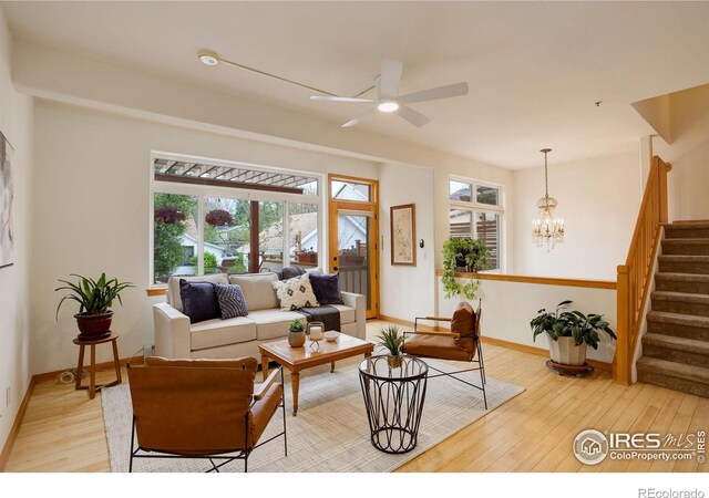 1460 Quince Ave Unit S102, Boulder, CO 80304 - living room with healthy amount of natural light, light wood-style flooring, ceiling fan, and baseboards