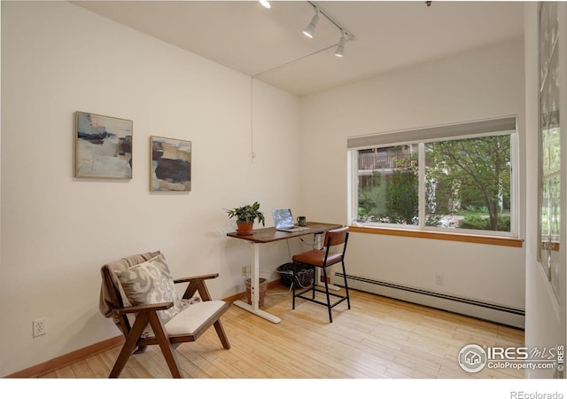 1460 Quince Ave Unit S102, Boulder, CO 80304 - office with baseboard heating, track lighting, and wood finished floors