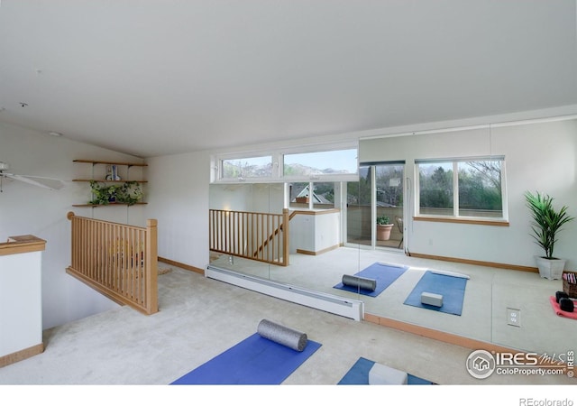 1460 Quince Ave Unit S102, Boulder, CO 80304 - exercise area featuring a baseboard radiator, carpet, vaulted ceiling, and baseboards