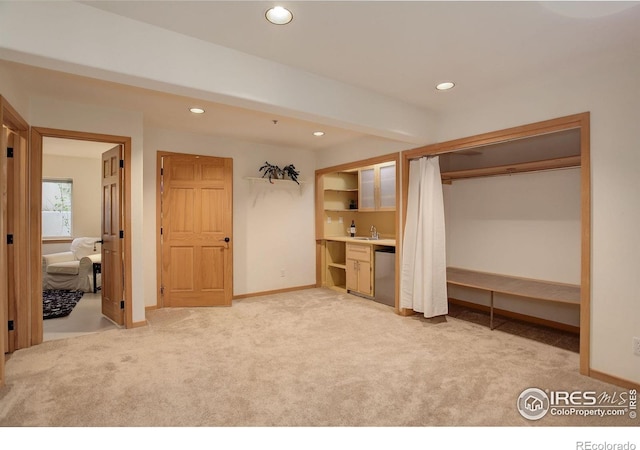 1460 Quince Ave Unit S102, Boulder, CO 80304 - unfurnished bedroom featuring recessed lighting, light colored carpet, baseboards, a sink, and multiple closets