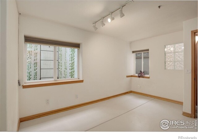 1460 Quince Ave Unit S102, Boulder, CO 80304 - empty room with rail lighting, concrete flooring, baseboards, and a pendent fire sprinkler