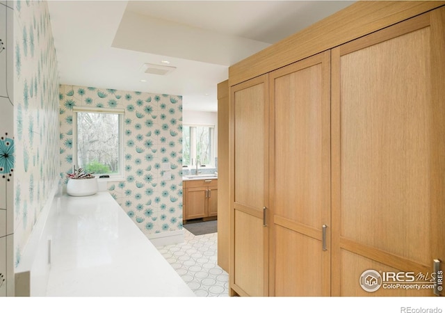2158 Tamarack Ave, Boulder, CO 80304 - bathroom featuring vanity, tile patterned floors, wallpapered walls, and a bath