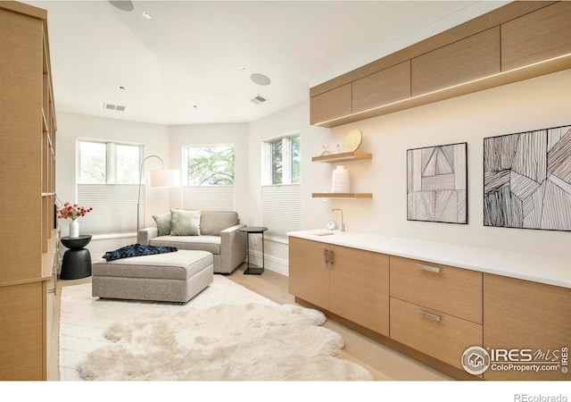 2158 Tamarack Ave, Boulder, CO 80304 - living area featuring visible vents, a healthy amount of sunlight, and light wood-type flooring