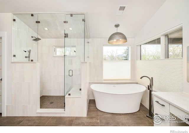 2158 Tamarack Ave, Boulder, CO 80304 - full bath featuring visible vents, a freestanding bath, tile walls, a shower stall, and tile patterned floors