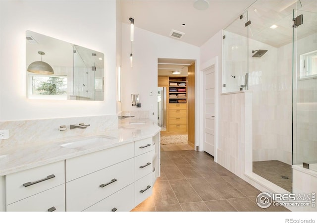 2158 Tamarack Ave, Boulder, CO 80304 - full bath featuring visible vents, vanity, lofted ceiling, a spacious closet, and a shower stall