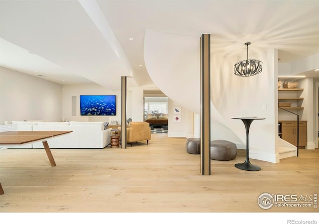 2158 Tamarack Ave, Boulder, CO 80304 - bonus room featuring light wood finished floors and a chandelier