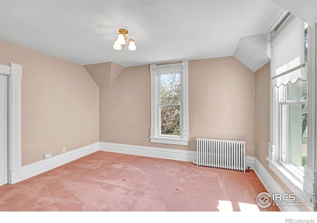 807 Collins St, Eaton, CO 80615 - bonus room featuring carpet floors, radiator, and lofted ceiling