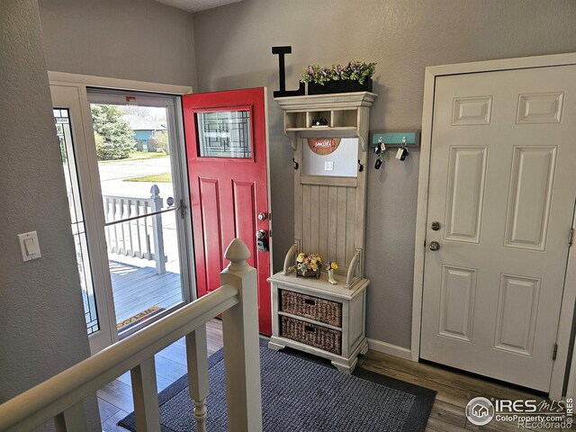 1628 Pheasant Rdg, Sterling, CO 80751 - mudroom with baseboards, a textured wall, and wood finished floors