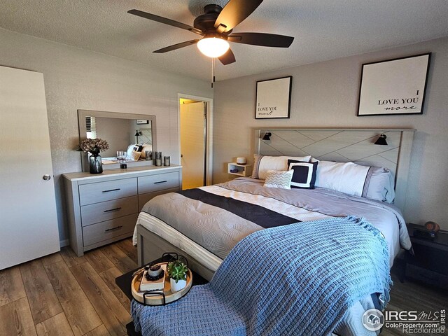 1628 Pheasant Rdg, Sterling, CO 80751 - bedroom with a textured ceiling, ceiling fan, and wood finished floors