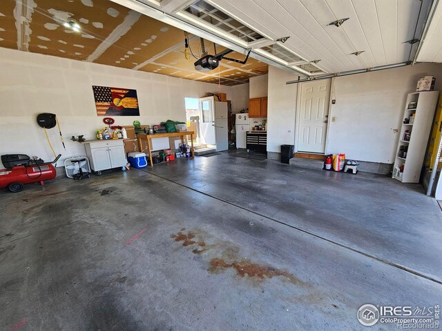 1628 Pheasant Rdg, Sterling, CO 80751 - garage with a garage door opener