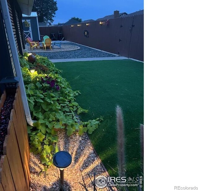 1628 Pheasant Rdg, Sterling, CO 80751 - view of yard featuring a patio and fence