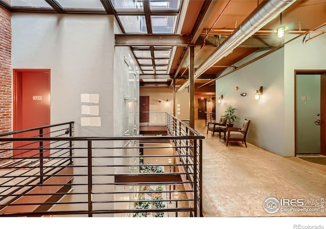 210 W Magnolia St Unit 320, Fort Collins, CO 80521 - stairs featuring concrete flooring