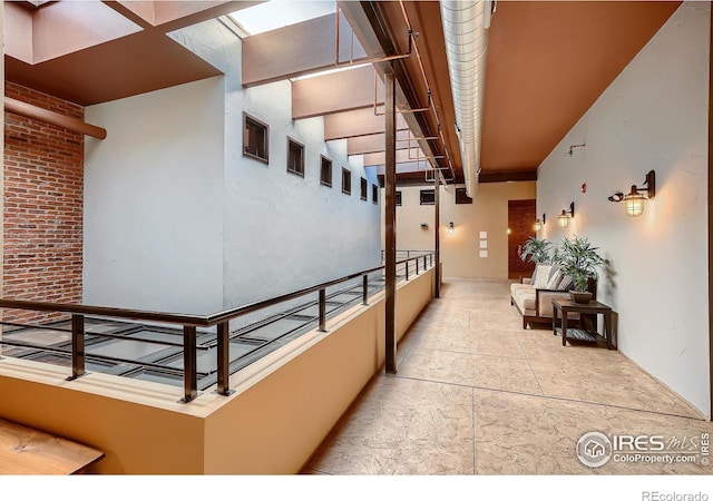 210 W Magnolia St Unit 320, Fort Collins, CO 80521 - corridor featuring stone finish floor