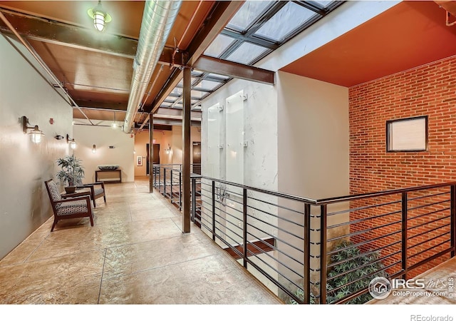 210 W Magnolia St Unit 320, Fort Collins, CO 80521 - hallway with stone finish flooring and an upstairs landing