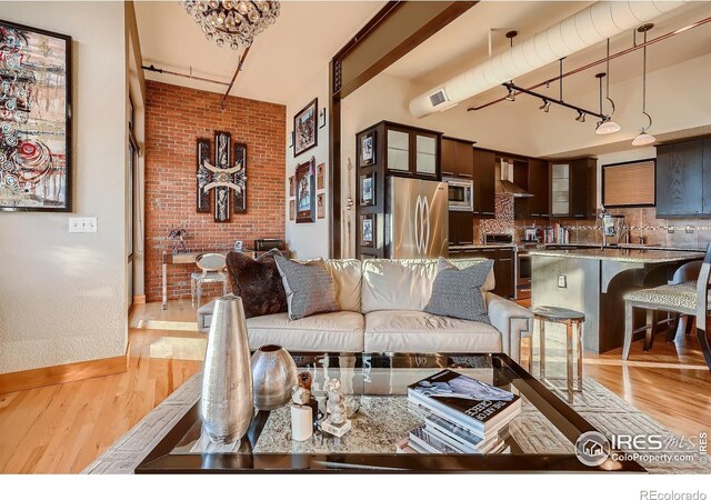 210 W Magnolia St Unit 320, Fort Collins, CO 80521 - living area featuring visible vents and light wood-type flooring
