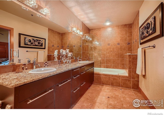 210 W Magnolia St Unit 320, Fort Collins, CO 80521 - full bath with a sink, a textured ceiling, tile patterned flooring, and double vanity