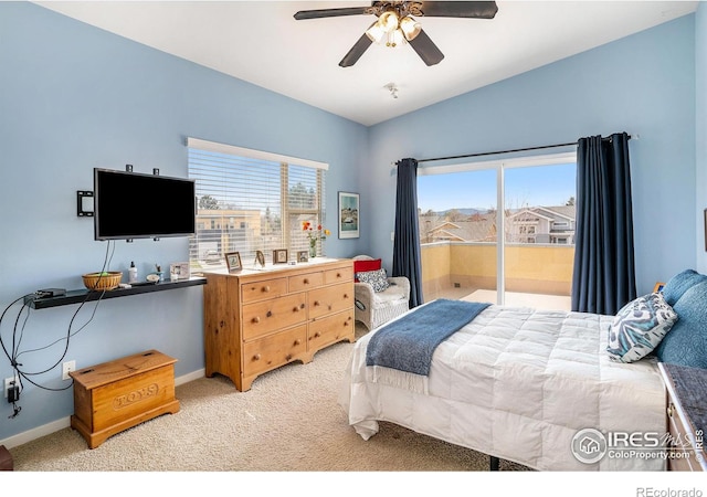156 Brass Ct Unit 156, Loveland, CO 80537 - bedroom featuring light colored carpet, baseboards, access to exterior, and multiple windows