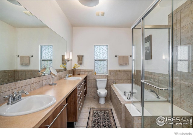 156 Brass Ct Unit 156, Loveland, CO 80537 - full bathroom with toilet, a relaxing tiled tub, tiled shower, and a sink