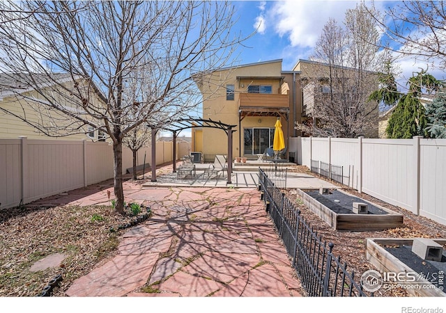 156 Brass Ct Unit 156, Loveland, CO 80537 - view of patio with a garden and a fenced backyard