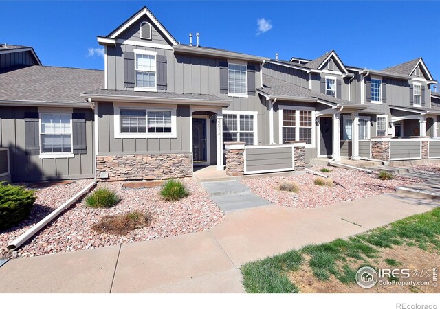 2203 Copper Creek Dr Unit D, Fort Collins, CO 80528 - view of front of property with board and batten siding and stone siding