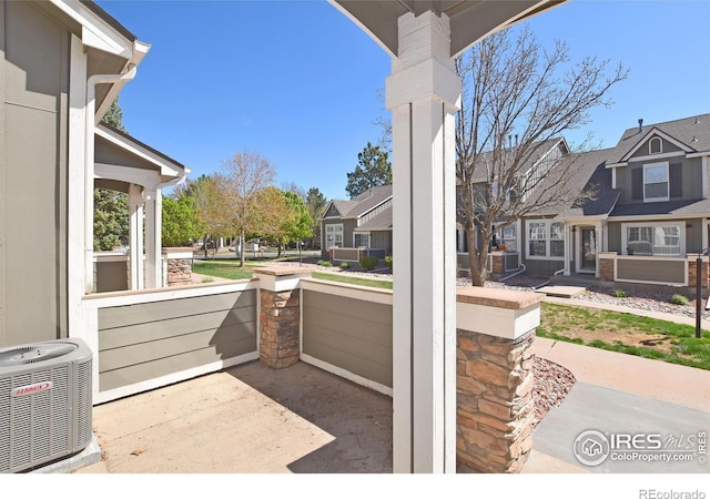 2203 Copper Creek Dr Unit D, Fort Collins, CO 80528 - view of patio with a residential view and cooling unit