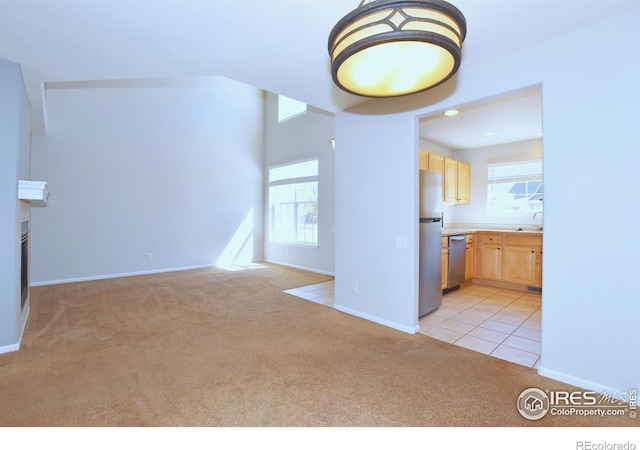 2203 Copper Creek Dr Unit D, Fort Collins, CO 80528 - interior space with a sink, baseboards, light carpet, and a wealth of natural light