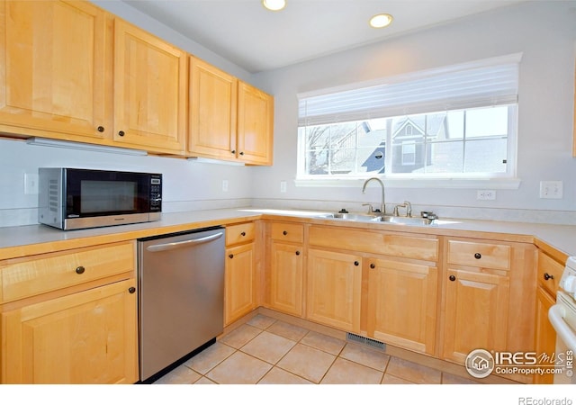 2203 Copper Creek Dr Unit D, Fort Collins, CO 80528 - kitchen with a sink, light brown cabinetry, light countertops, and dishwasher