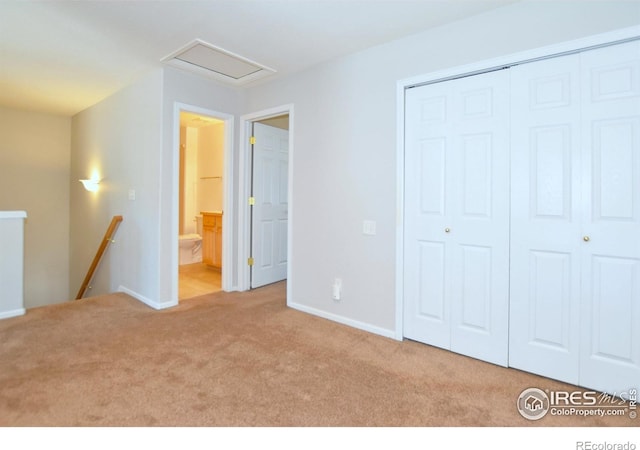 2203 Copper Creek Dr Unit D, Fort Collins, CO 80528 - unfurnished bedroom featuring carpet floors, baseboards, a closet, and attic access