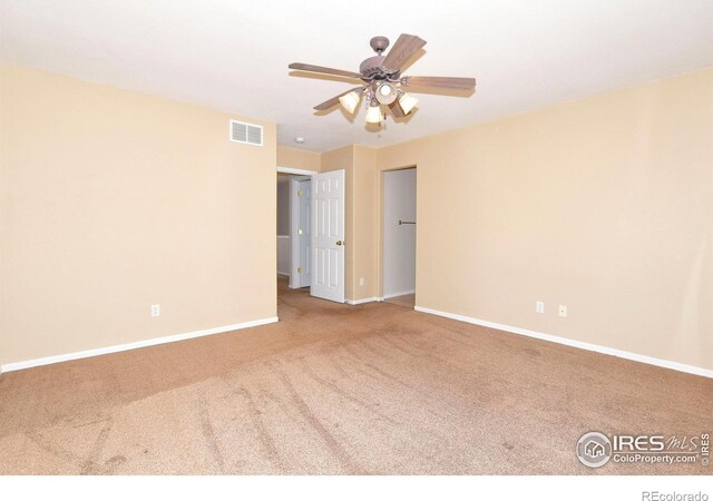 2203 Copper Creek Dr Unit D, Fort Collins, CO 80528 - carpeted spare room with baseboards, visible vents, and ceiling fan