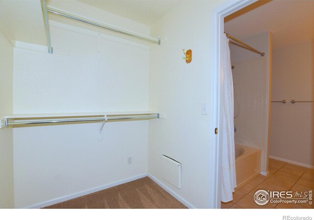 2203 Copper Creek Dr Unit D, Fort Collins, CO 80528 - interior space featuring tile patterned floors, baseboards, and shower / bath combo