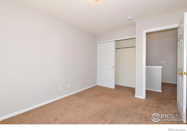 2203 Copper Creek Dr Unit D, Fort Collins, CO 80528 - unfurnished bedroom featuring carpet floors, baseboards, and a closet