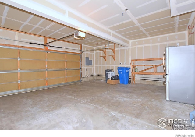 2203 Copper Creek Dr Unit D, Fort Collins, CO 80528 - garage with freestanding refrigerator and a garage door opener