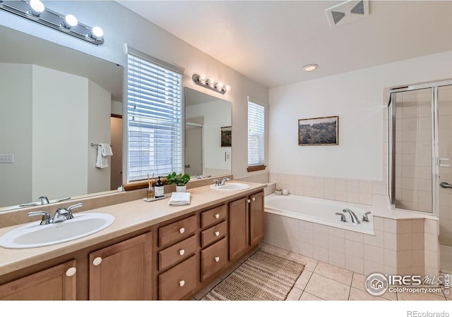 1602 Prairie Song Pl, Longmont, CO 80504 - bathroom with visible vents, a sink, a bath, and a stall shower