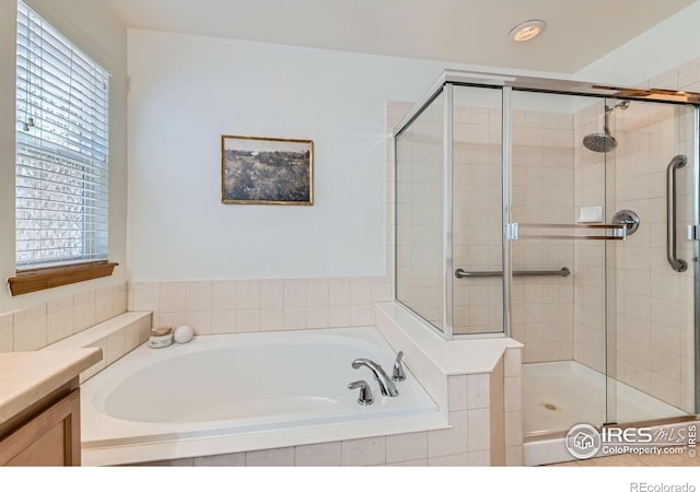 1602 Prairie Song Pl, Longmont, CO 80504 - full bath featuring a bath, a stall shower, and a healthy amount of sunlight
