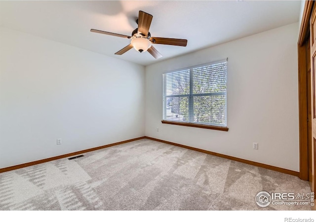1602 Prairie Song Pl, Longmont, CO 80504 - carpeted spare room featuring ceiling fan, visible vents, and baseboards