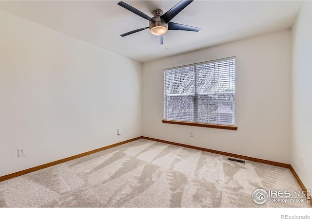1602 Prairie Song Pl, Longmont, CO 80504 - carpeted spare room with baseboards, visible vents, and ceiling fan