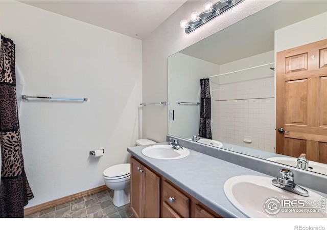 1602 Prairie Song Pl, Longmont, CO 80504 - bathroom with baseboards, a sink, curtained shower, and toilet