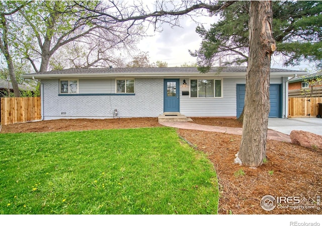 810 34th St, Boulder, CO 80303 - single story home featuring brick siding, fence, driveway, and a front yard