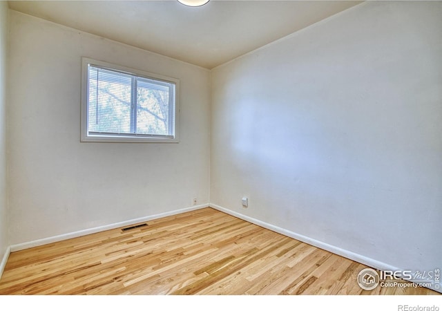 810 34th St, Boulder, CO 80303 - unfurnished room featuring baseboards, wood finished floors, and visible vents