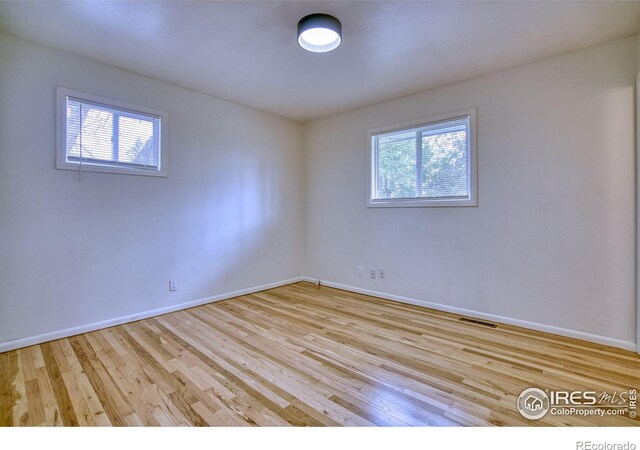810 34th St, Boulder, CO 80303 - spare room with baseboards, visible vents, and wood finished floors