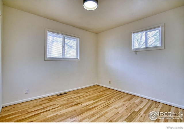 810 34th St, Boulder, CO 80303 - unfurnished room featuring baseboards, wood finished floors, and a wealth of natural light